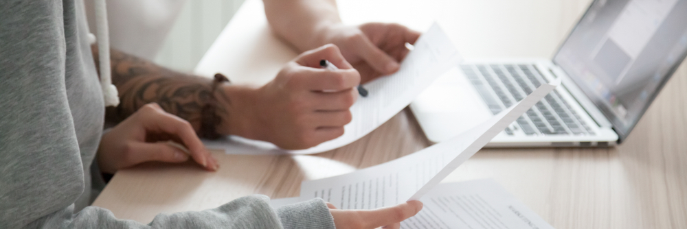 Couple reviewing lease to ensure tenant rights