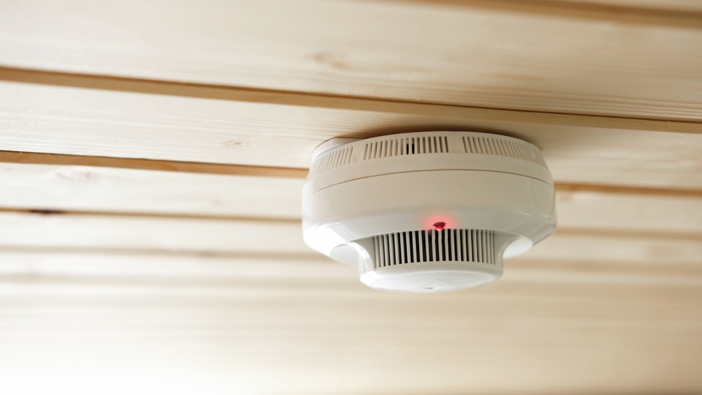Close-up of a fire alarm and smoke detector