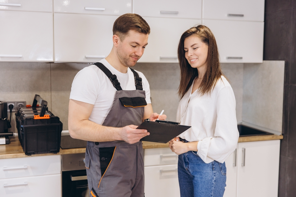 A tenant speaking with an apartment maintenance worker