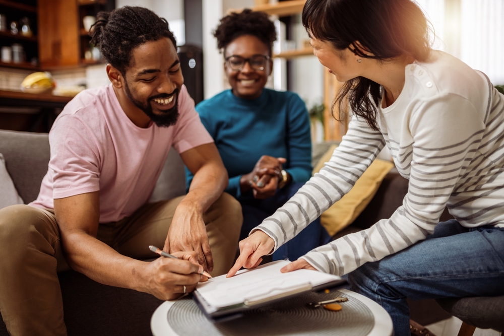 A family reviewing the details of an apartment lease